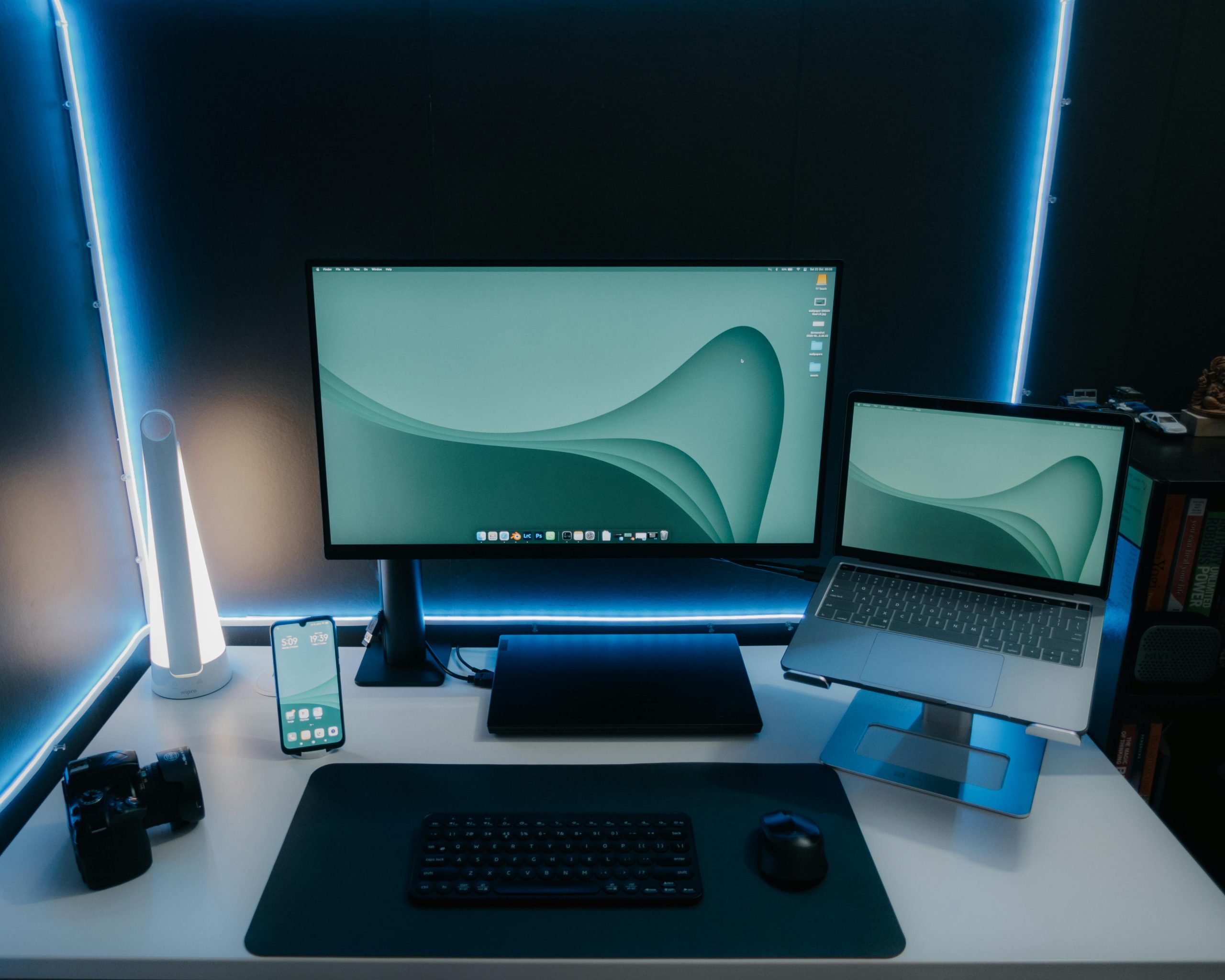 Clean desk setup with laptop stand and monitor